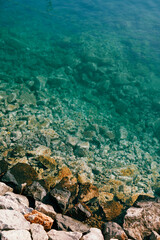 Transparent turquoise sea with a rocky bottom