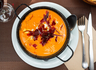 Cordoban salmorejo with ham and egg shavings is a traditional Spanish cold tomato soup.