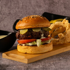 Brioche Cheeseburger with Pickles, Cheese, and French Fries