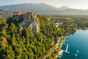 Aerial view of the medieval Bled Castle on a high cliff at Lake Bled in Slovenia