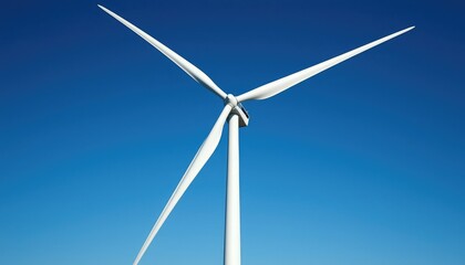 A tall wind turbine against a clear blue sky, showcasing renewable energy technology and sustainability.