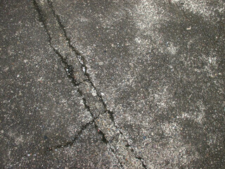 Obraz premium Close-up of concrete surface with unique pattern and cracks. Suitable for architectural and graphic projects, background
