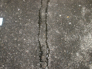 Close-up of concrete surface with unique pattern and cracks. Suitable for architectural and graphic...