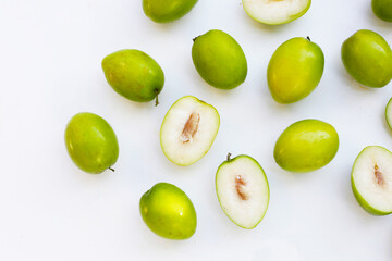Green jujube fruits on white background.