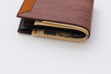 Brown wallet on white background.