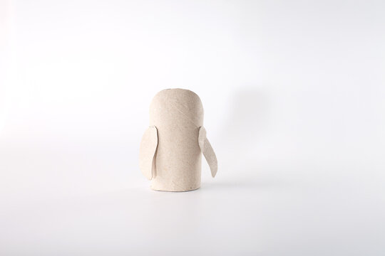 Simple cardboard roll craft project showing repurposing of everyday items. step in creative process. kids activity centers, or DIY craft blogs focusing on creative reuse and eco-conscious projects