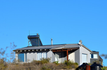 self-sustaining houses, water heaters and solar panels, ecology and sustainability