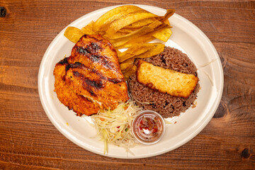 Chicken with plantain chips and rice