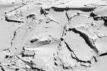 Cement spatula strokes close-up texture.