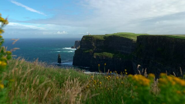 Massive cliffs stretch along the Atlantic coast, their steep edges carved by wind and waves. The Cliffs of Moher stand as one of Ireland&rsquo;s most breathtaking natural landmarks.