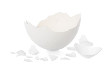 Pieces of cracked egg shell on white background