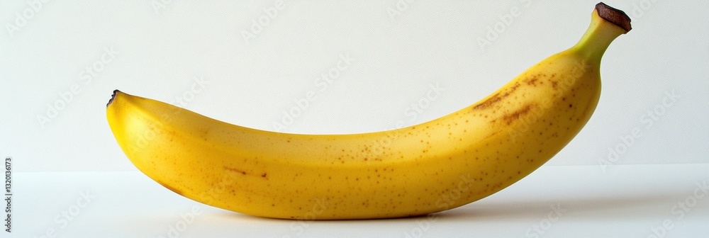 Aufkleber single banana on a white background showcasing minimalism and soft natural lighting with balanced co