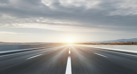 Naklejka premium Open highway leading to bright horizon at sunrise