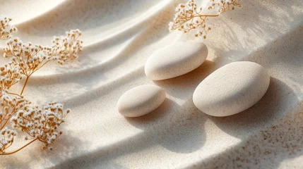 Fototapete Rund Three smooth stones are resting in a textured sand surface © addymawy
