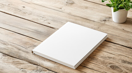 Fototapeta premium minimalist workstation featuring blank sketchpad on wooden table
