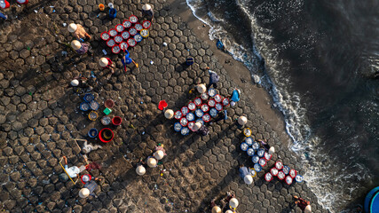Dawn at Phuoc The fishing port, Binh Thuan, when the fishing boats return to the wharf, the fishing...