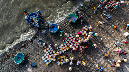Dawn at Phuoc The fishing port, Binh Thuan, when the fishing boats return to the wharf, the fishing...