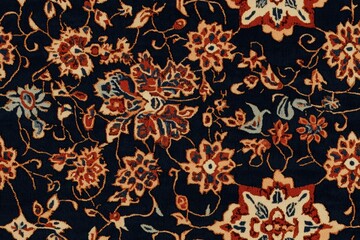 Seamless indian carpet fabric traditional Persian rug with intricate floral patterns in red, orange, and blue on a dark background.