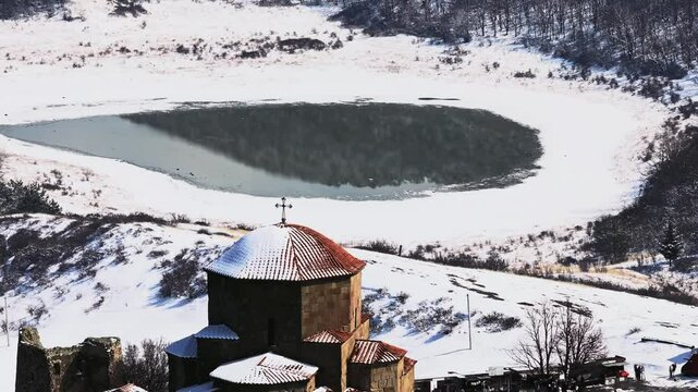 Aerial footage of the Jvari monastery, VI century, UNESCO Heritage. Drone flight over Jvari Monastery near Mtskheta, Georgia, on a sunny day, with beautiful views during daytime.