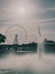 Ferris Wheel and Fountain in the Sunset
