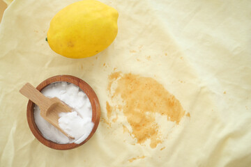 Lemon and baking soda on a kitchen cloth for cleaning purposes