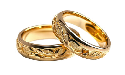 gold wedding rings with engraved floral design on white background