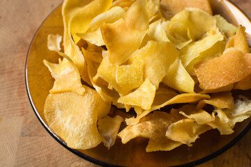 Overhead view of golden sweet potato chips, top view of crispy fried sweet potato chips