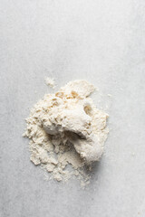 Overhead view of steamed bun dough being kneaded, top view of mantou dough being mixed, process of making steamed milk buns