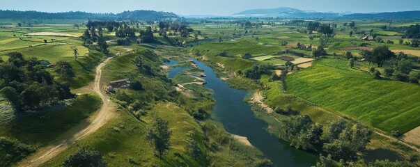 Serene Aerial View of Lush Green Fields and Calm River Landscape