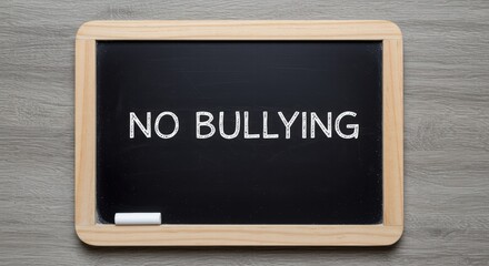 A black board displaying the message stop bullying