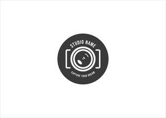 Dark grey camera lens logo