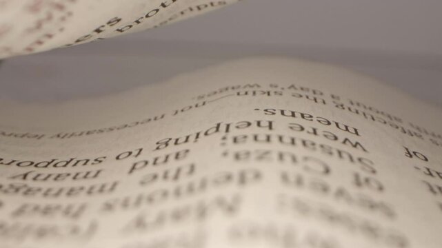 Unique Shot of the Camera Going Through the Bible