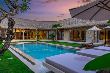 Balenese Pool Villa in Seminyak on the beautiful island of Bali colourful skies lush green tress Bali Indonesia