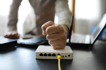 Modern dual band wireless router. Man working in the background. Fast and wireless internet concept.