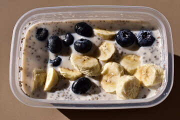 a healthy breakfast of overnight oats with milk, A bowl of overnight oats