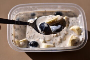 a healthy breakfast of overnight oats with milk, A bowl of overnight oats