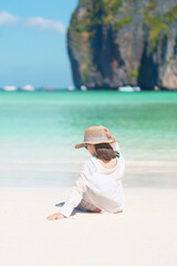 Woman tourist traveling and sightseeing in Krabi, Thailand, happy traveller enjoy at Maya Bay beach...