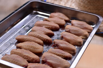 delicious crispy chicken wings arranged, Fried chicken wings in frying pan, Crispy Fried Chicken with Fish Sauce