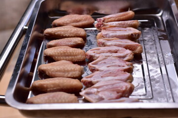 delicious crispy chicken wings arranged, Fried chicken wings in frying pan, Crispy Fried Chicken with Fish Sauce