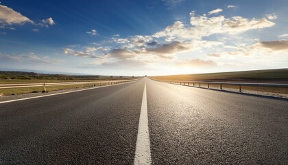 empty asphalt road stretching to horizon under sunny sky