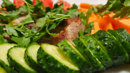 A real photo of a steak with vegetables on a plate