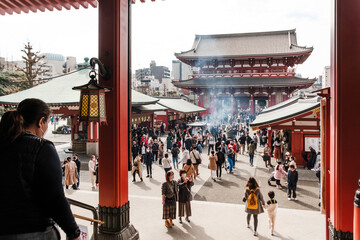 Tokyo, Japan - March 6th 2023 - Sensoji Temple bustling with tourists and worshippers. This...