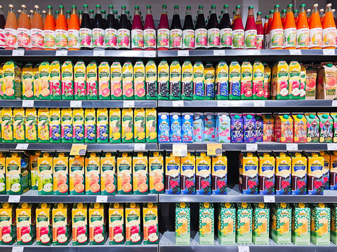 LATVIA, RIGA, 05, MARCH, 2025: Juice tetra pack packages from various manufacturers are shown on a shelf for sale in a Rimi supermarket. Riga, Latvia