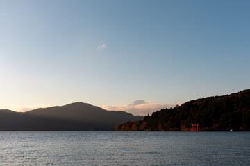 Mt. Fuji and red Torii gate on lake Ashi at Sunset, Hakone, Japan