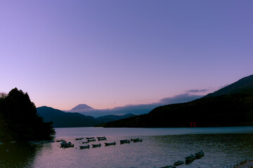 Mt. Fuji and small boats on lake Ashi at Sunset, Hakone, Japan