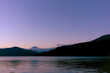 Mt. Fuji and red Torii gate on lake Ashi at Sunset, Hakone, Japan