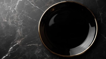 Glossy black porcelain plate on marble.