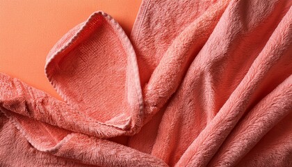 coral texture background soft terrycloth towel on peach surface