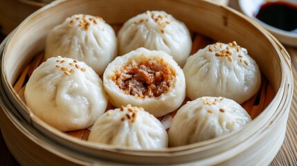 Soft and fluffy Asian buns filled with tender BBQ pork are served in a traditional bamboo steamer, inviting everyone to indulge in their savory goodness