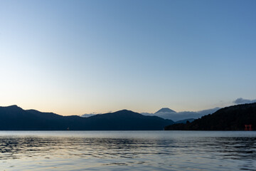 Mt. Fuji and red Torii gate on lake Ashi at Sunset, Hakone, Japan
